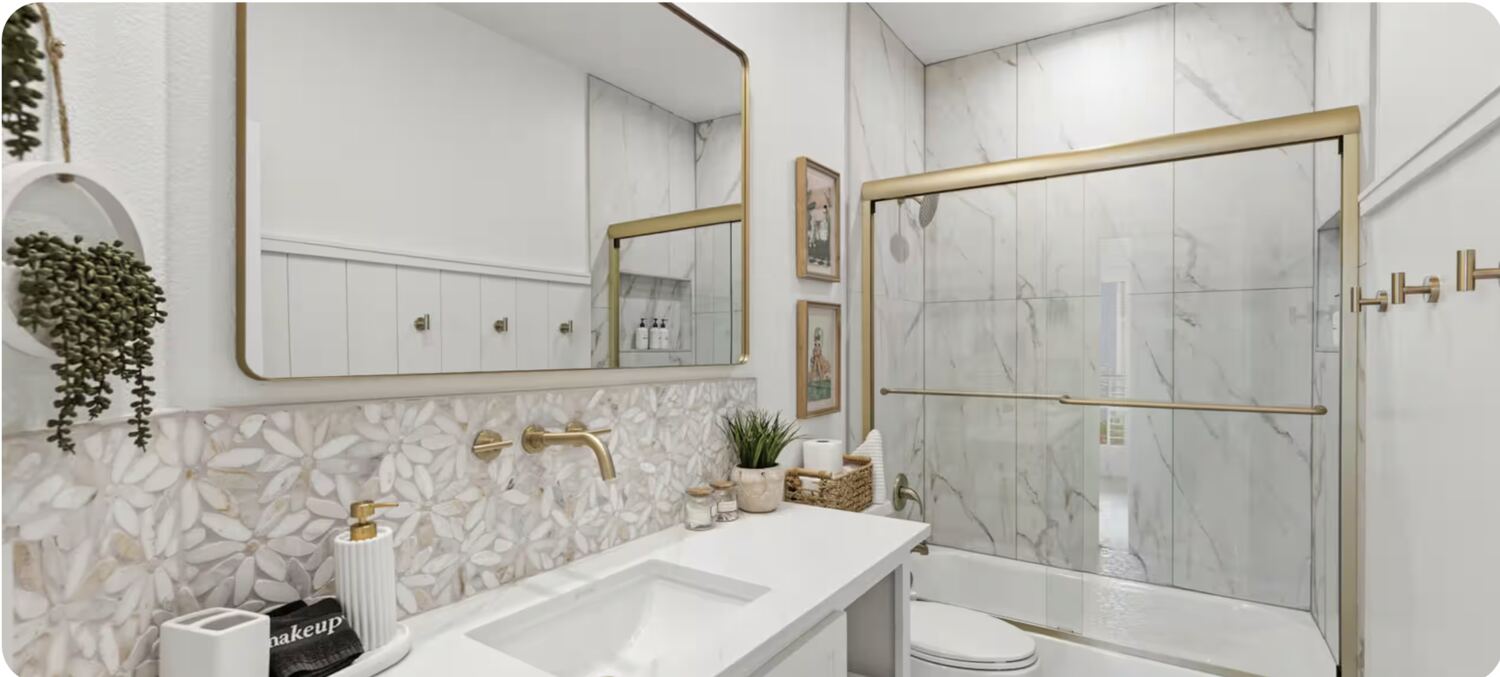 Bathroom with floral mosaic tile and brass fixtures