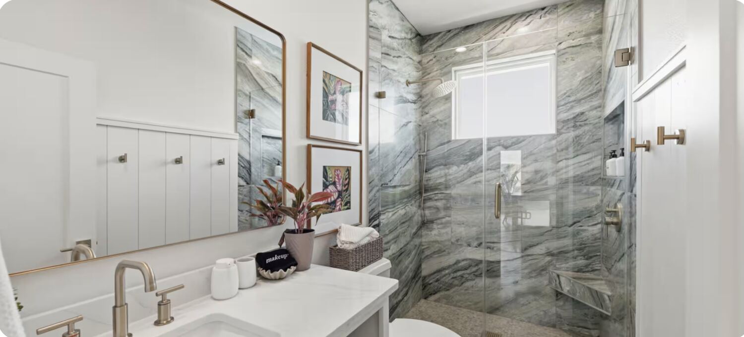 Bathroom with gray-green marble shower surround