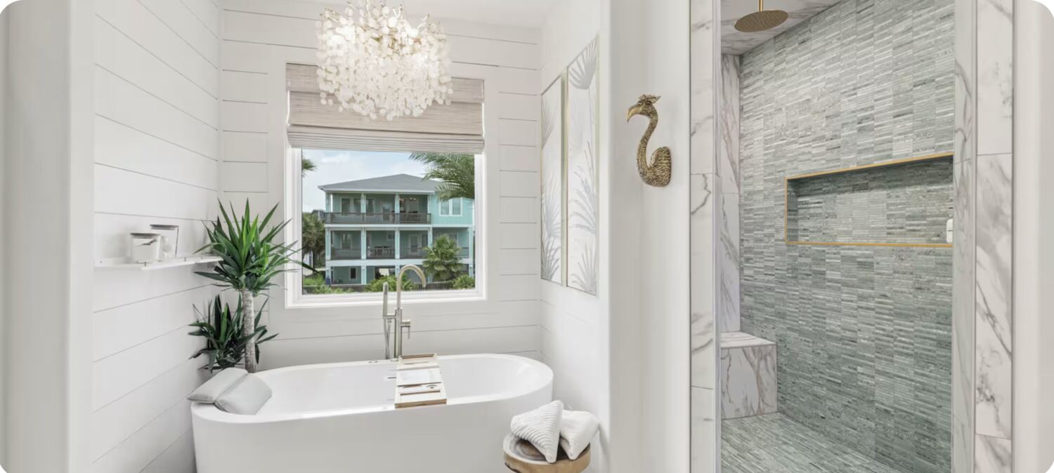 Bathroom with freestanding tub and capiz shell chandelier