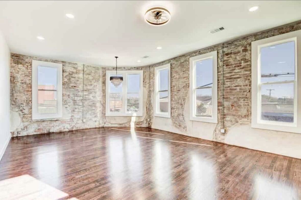 Loft with exposed brick and large windows